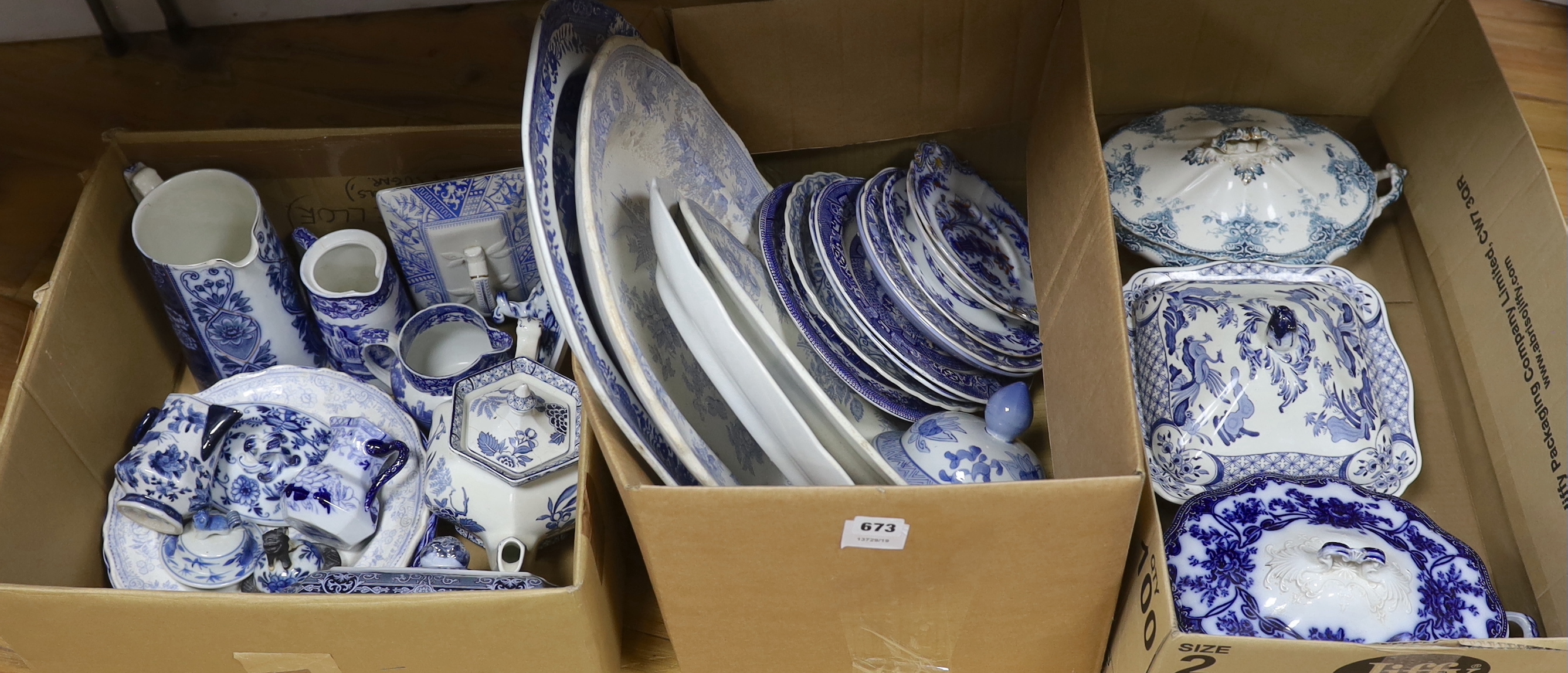 A collection of 19th / 20th century blue and white pottery including platters, tureens and jugs